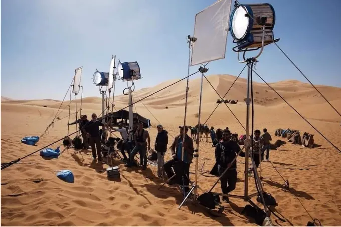 Lighting rig and crew on a desert set