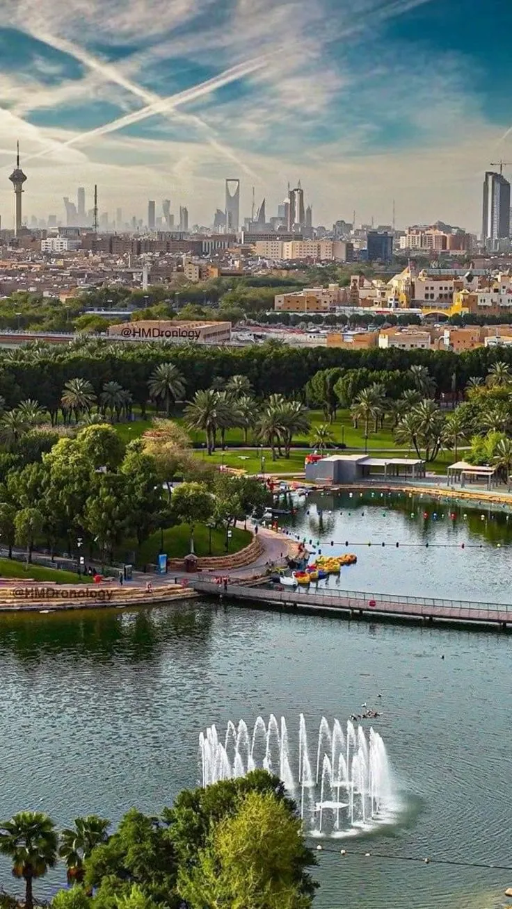 Riyadh skyline over a city park